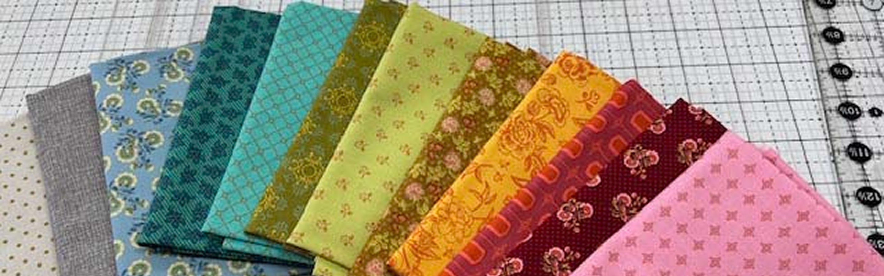 Collection of colorful fabric samples on a grid background