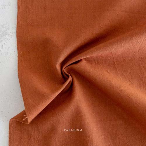 Sprout Woven - Umber - rust brown - texture w/a small woven "x"