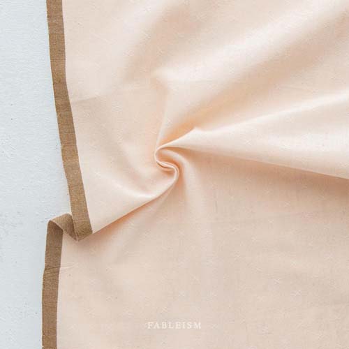 Sprout Woven - Almond - pale peach - texture w/a small woven "x"